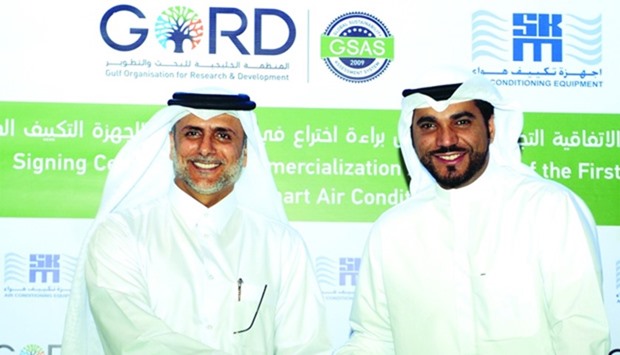 GORD founding chairman Yousef al-Horr (left) and SKM executive director Abdul Karim al-Saleh after signing the agreement for the commercialisation of GORDu2019s smart AC cooling system. PICTURE: Shemeer Rasheed