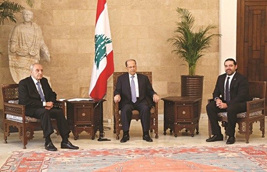 Lebanese President Michel Aoun, centre, meeting with Parliament Speaker Nabih Berri, left, and newly-designated Prime Minister Saad Hariri at the presidential palace in Baabda, east of Beirut, on November 3.