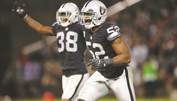 Oakland Raiders defensive end Khalil Mack (R) reacts after the Raiders recovered a fumble against the Denver Broncos in the fourth quarter at Oakland Coliseum. PICTURE: USA TODAY Sports