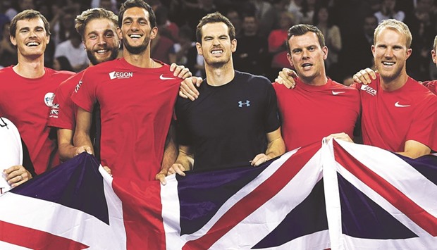 In this March 8, 2015, picture, (from left) Great Britainu2019s Jamie Murray, Liam Broady, James Ward, Andy Murray, captain Leon Smith and Dominic Inglot pose  for a photograph after their win over the USA in the Davis Cup World Group First Round in Glasgow.
