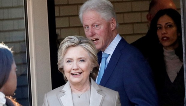 Hillary Clinton and her husband former Bill Clinton depart after voting in the US presidential election 