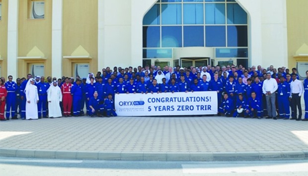 Oryx GTL officials and staff raise the 'Zero TRIR' banner to celebrate the company's achievement