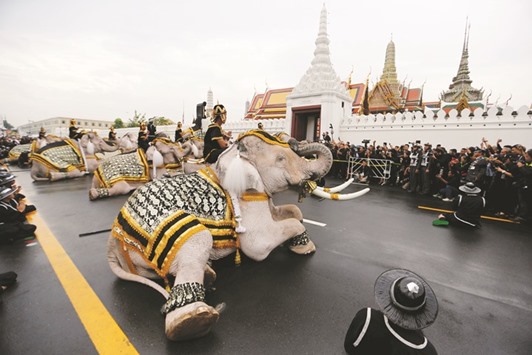 Ayuthaya elephants and mahouts pay their respects at the Royal Palace where Thailandu2019s late king Bhumibol Adulyadej is lying in state, in Bangkok, yesterday.