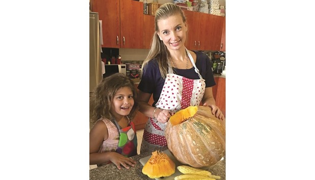 VEGAN STORY: Sarah plies nutrition with her daughter Ivy.