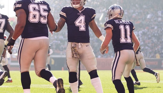 File picture of Dallas Cowboys quarterback Dak Prescott (C).