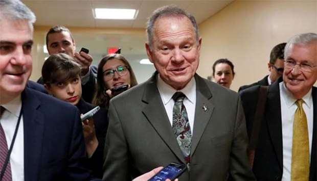 Alabama Republican candidate for US Senate Roy Moore speaks with reporters in Washington.