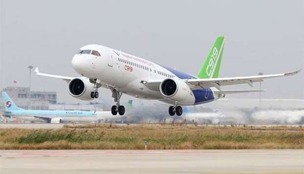 The Comac C919, China's first large passenger jet, takes off from Pudong International Airport in Shanghai on Friday.