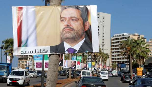 Posters depicting Lebanon's Prime Minister Saad al-Hariri, who has resigned from his post, are seen in Beirut, Lebanon