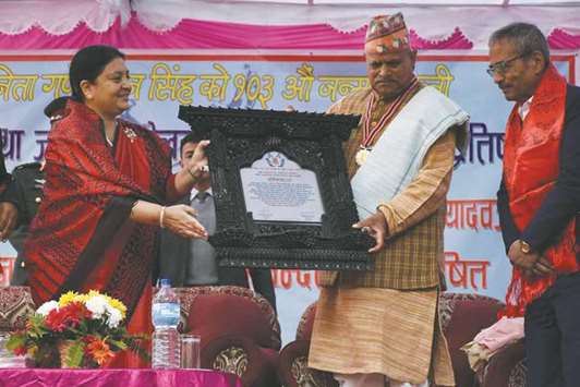 Nepal President Bidhya Devi Bhandari conferring Jana Aandolan Swarna Padaka 2074 to former president Ram Baran Yadav for his contribution in peace process, strengthening unity between Himal, Pahad and Tarai and promulgation of the constitution.
