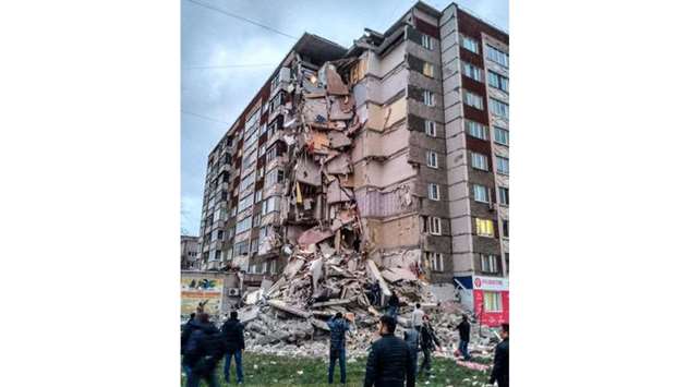 The partially collapsed nine-storey residential building in Izhevsk.