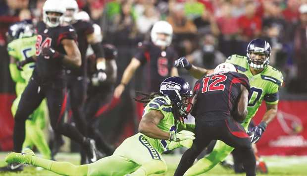 Seattle Seahawks cornerback Richard Sherman (No 25) ruptured his Achilles tendon as he tackles Arizona Cardinals wide receiver John Brown (No 12) in the second-half at University of Phoenix Stadium. PICTURE: USA TODAY Sports