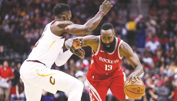 Houston Rockets guard James Harden (right) attempts to dribble the ball past Cleveland Cavaliers forward Jeff Green during the second quarter at Toyota Centre. PICTURE: USA TODAY Sports