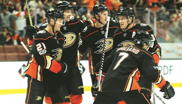 Andrew Cogliano (No 7, Chris Wagner (No 21), Hampus Lindholm (No 47), and Dennis Rasmussen (No 22) congratulate Jakob Silfverberg (No 33) of the Anaheim Ducks on his goal during the third period of the NHL game against Vancouver Canucks at Honda Centre in Anaheim, California. (Getty Images/AFP)