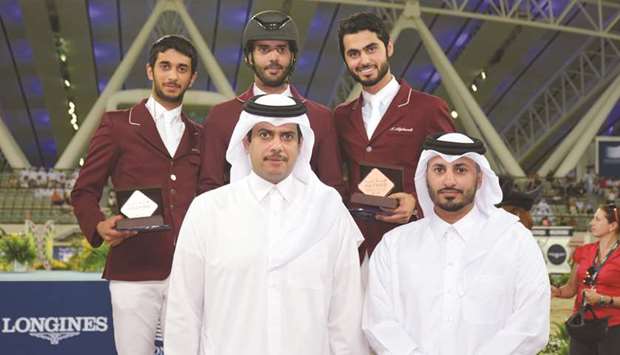 Podium winners of Big Tour class at Hathab series pose with Qatar Equestrian Federation President Hamad bin Abdulrahman al-Attiyah (left) and Event Director Ali al-Rumaihi yesterday.