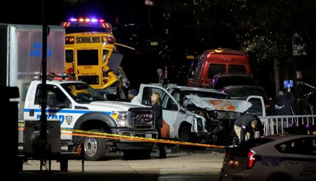 Police investigate a pickup truck used in an attack on the West Side Highway in Manhattan, New York, US