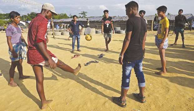 Rohingya refugees play chinlone at Kutupalong refugee camp in the Bangladeshi district of Ukhia.