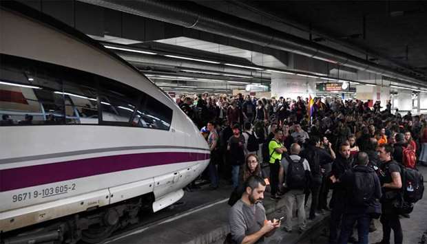 Protesters block train tracks at the Sants Station in Barcelona during a strike called by a pro-independence union in Catalonia