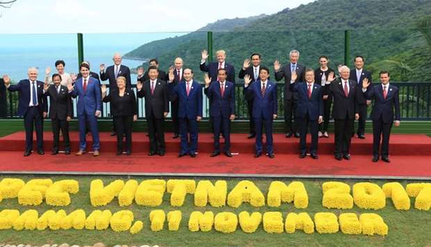 Leaders pose during the Asia-Pacific Economic Cooperation (APEC) leaders' summit