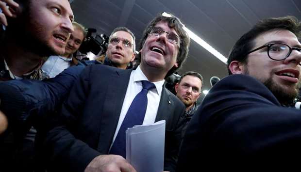 Sacked Catalan leader Carles Puigdemont departs after a news conference at the Press Club Brussels Europe in Brussels, Belgium
