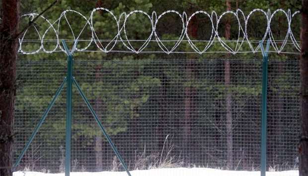A fence on the border with Russia is seen in Katlesi, Latvia