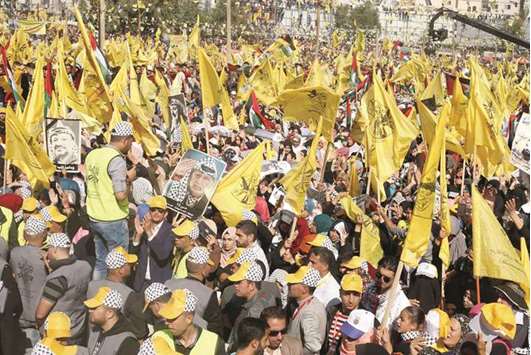 Fatah supporters take part in a rally marking the death anniversary of Yasser Arafat in Gaza City yesterday.