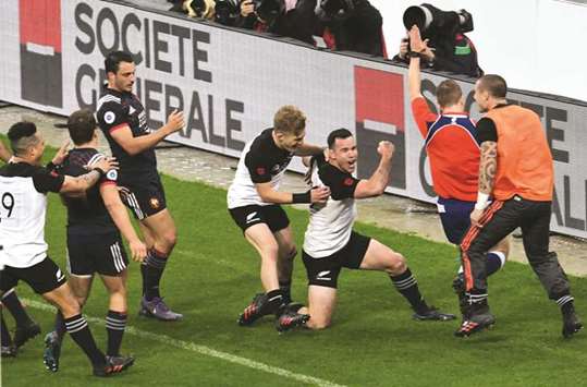 New Zealandu2019s centre Ryan Crotty (C) celebrates after scoring a try during their friendly rugby union international Test match against France at The Stade de France Stadium, in Saint-Denis, on the outskirts of Paris, on Saturday.