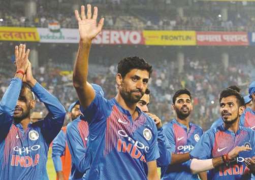 Indian bowler Ashish Nehra (centre) waves at supporters as he leaves the field with his team at the end of the first T20 match against New Zealand at Feroz Shah Kotla Cricket Stadium in New Delhi yesterday. (AFP)