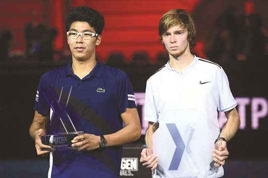 Winner Hyeon Chung (left) of South Korea and runner-up Andrey Rublev of Russia pose with their trophies at Next Generation ATP Finals in Milan yesterday. (AFP)