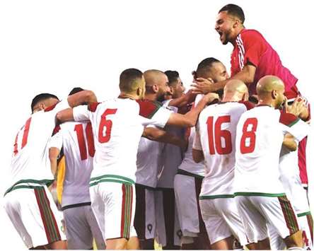 Morocco players celebrate during the World Cup qualifier against Ivory Coast. (AFP)