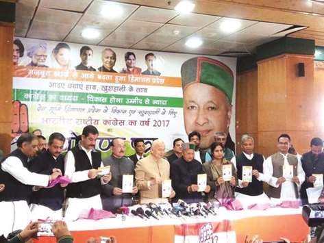 Himachal Pradesh Chief Minister Virbhadra Singh and Congress leader Sushil Kumar Shinde attend a programme held to release the partyu2019s manifesto in Shimla yesterday.