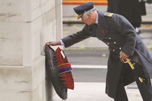 Prince Charles, Prince of Wales, lays a wreath during the Remembrance Sunday ceremony at the Cenotaph on Whitehall in central London yesterday.