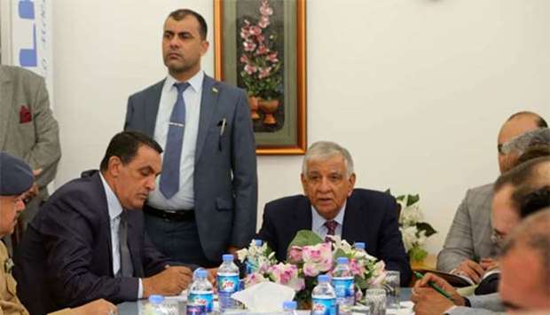 Iraqi Oil Minister Jabbar al-Luaybi (centre) attends a meeting with Kirkuk governor Rakan Said (second left) during a visit to Kirkuk on Monday.