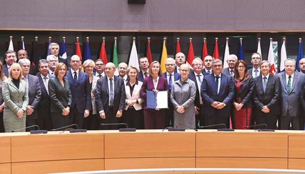 EU Foreign Policy Chief Federica Mogherini (centre) with some foreign and defence ministers from 23 EU member states after they signed the PESCO agreement on the sidelines of a foreign affairs council at the European Council in Brussels.