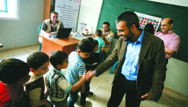 Farooq Burney interacts with some of the students in Gaza.