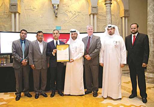 Dr Khalid bin Ibrahim al-Sulaiti and British ambassador Ajay Sharma show Katarau2019s new international achievement.