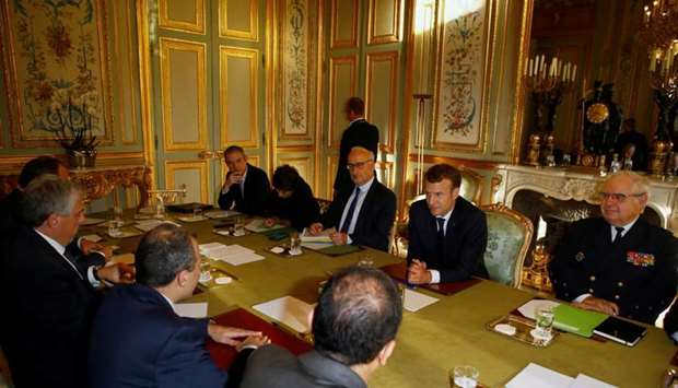 Lebanese Foreign Minister Gebran Bassil (2ndL) and French President Emmanuel Macron (2ndR) attend a meeting at the Elysee Palace in Paris