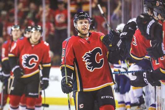 Calgary Flames right wing Kris Versteeg (10) celebrates his goal with teammates against the St. Louis Blues during the third period at Scotiabank Saddledome. Calgary Flames won 7-4. PICTURE: Sergei Belski-USA TODAY Sports