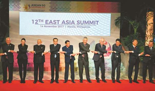 (From left) US State Secretary Rex Tillerson, New Zealand Prime Minister Jacinda Ardern, Indian Prime Minister Narendra Modi, Chinese Premier Li Keqiang, Philippine President Rodrigo Duterte, Singaporean Prime Minister Lee Hsien Loong, Australian Prime Minister Malcolm Turnbull, Japanese Prime Minister Shinzo Abe, South Korean President Moon Jae-in and Russian Prime Minister Dmitry Medvedev attend a photo session for the 12th East Asia Summit on the sidelines of the 31st Association of Southeast Asian Nations (Asean) Summit in Manila yesterday.