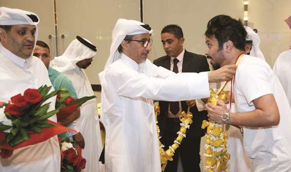 Minister of Culture and Sports HE Salah bin Ghanem bin Nasser al-Ali (left) met the players at Hamad International Airport