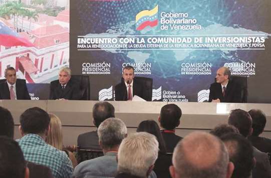 Venezuelan Vice President Tareck El Aissami speaks during a meeting with creditors and investors in Caracas.