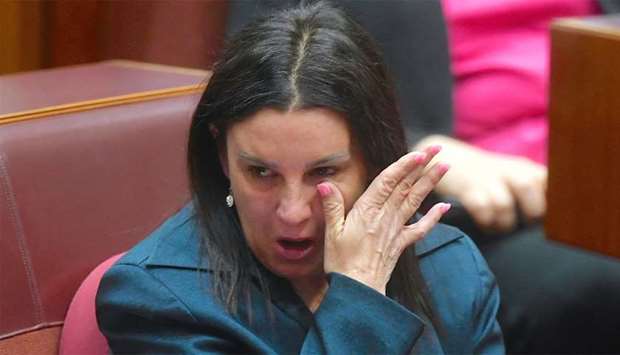 Jacqui Lambie, an independent and outspoken senator for the island state of Tasmania, reacts after delivering a statement regarding her resignation