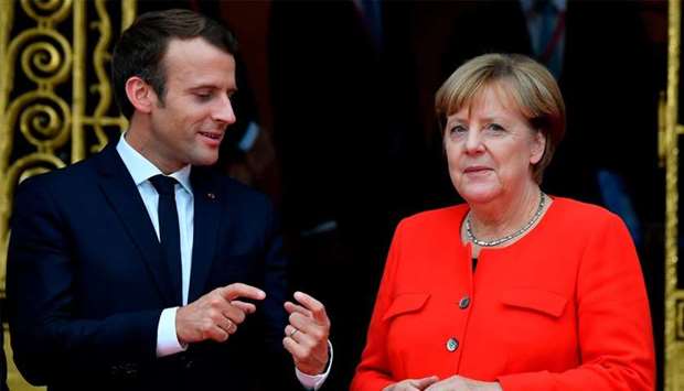 French President Emmanuel Macron with German Chancellor Angela Merkel