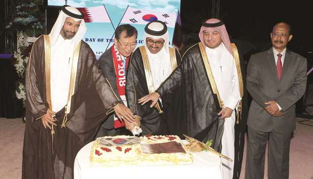 South Korean ambassador Heung Kyeong-park, Qataru2019s Minister of Energy and Industry HE Dr Mohamed bin Saleh al-Sada, Ministry of Foreign Affairsu2019 Chief of Protocol Ibrahim Yousif Abdullah Fakhroo and other dignitaries lead the cake-cutting ceremony at the Korean National Day reception yesterday at the embassy. PICTURE: Othman al-Samarrae