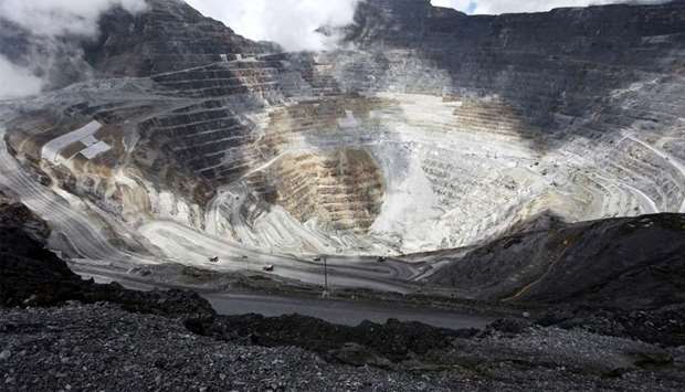 Trucks operate in the open-pit mine of PT Freeport's Grasberg copper and gold mine complex near Timika