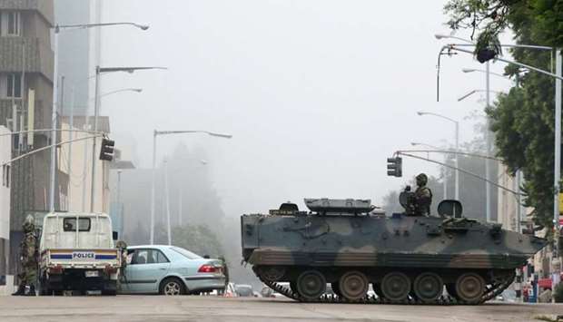 Military vehicles and soldiers patrol the streets in Harare, Zimbabw