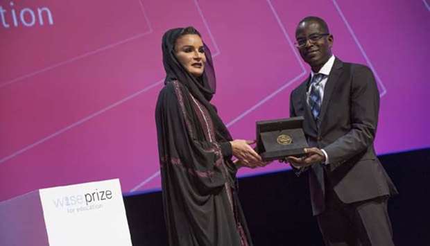 Her Highness Sheikha Moza bint Nasser presents the WISE Prize to Patrick Awuah at World Innovation Summit for Education in Doha on Wednesday.