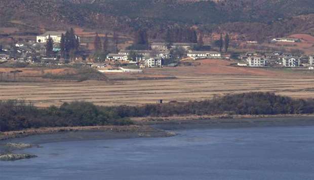 A North Korean guard post (C) in the border county of Kaepoong