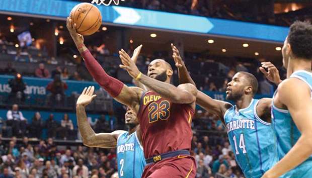 Cleveland Cavaliersu2019 LeBron James (second from left) drives to the basket against Charlotte Hornets during their NBA game on Wednesday. (USA TODAY Sports)