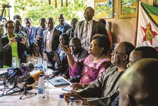 Peopleu2019s Rainbow Coalition leader Joice Mujuru (third right) speaks at a press conference where she called for a transitional arrangement in Harare yesterday.