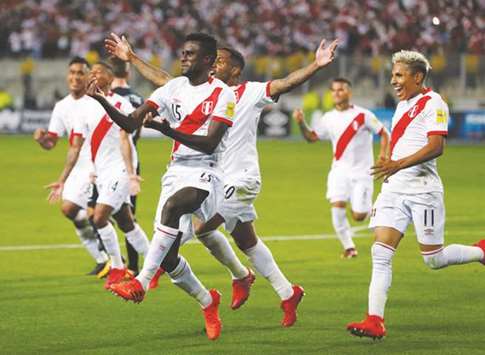 Peruu2019s Christian Ramos (centre) celebrates with teammates after scoring against New Zealand in the 2018 World Cup qualifying Playoffs at the National Stadium in Lima, Peru, on Wednesday night. (Reuters)